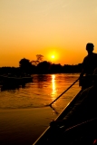 Boats on the Tres Irmaos River at sunset, Pantanal, Brazil