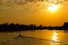 Boat heading up the Cuiaba River, Pantanal , Brazil